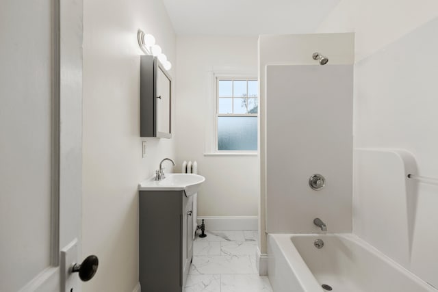 bathroom featuring vanity and  shower combination