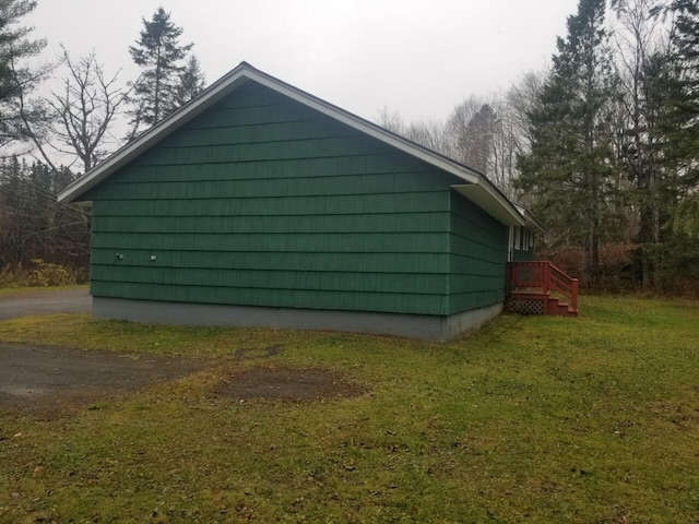 view of home's exterior featuring a yard