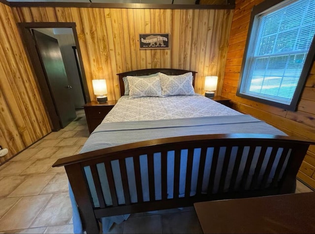 bedroom featuring wooden walls