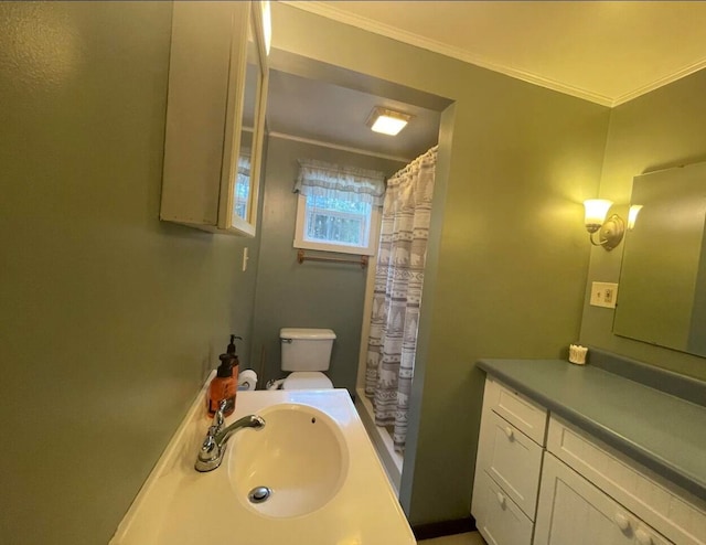 bathroom with toilet, a shower with curtain, vanity, and ornamental molding