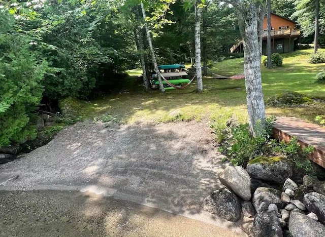 view of yard with a wooden deck