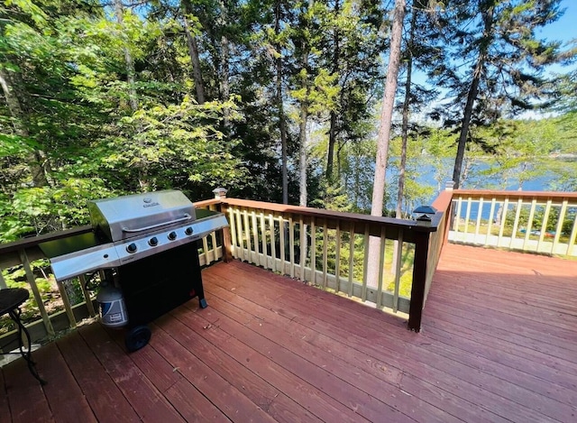 wooden terrace featuring area for grilling