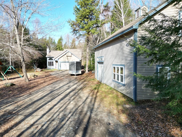 view of side of property with a playground