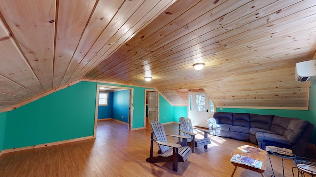 living room with an AC wall unit, vaulted ceiling, wooden ceiling, and light hardwood / wood-style floors