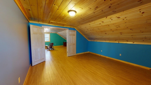 bonus room with wooden ceiling, hardwood / wood-style flooring, and vaulted ceiling