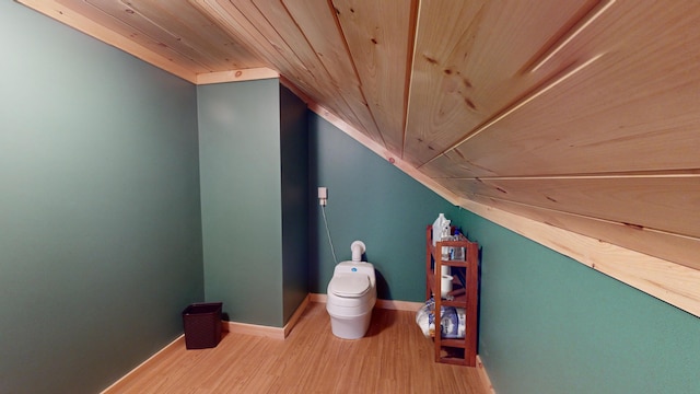 bathroom featuring toilet, wood ceiling, wood-type flooring, and vaulted ceiling