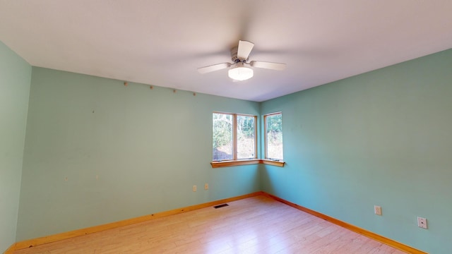 unfurnished room with light hardwood / wood-style floors and ceiling fan