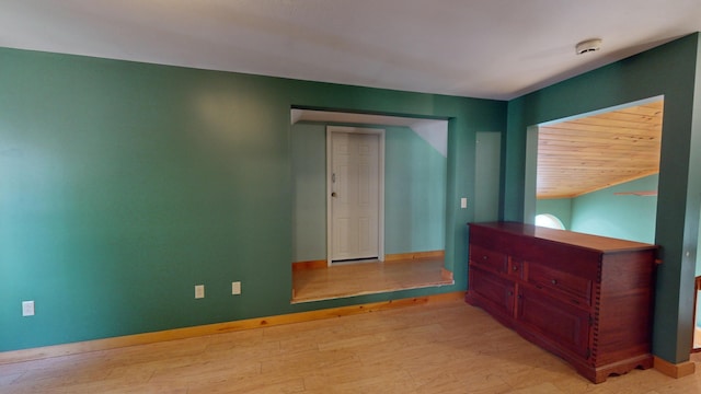 unfurnished room with light wood-type flooring