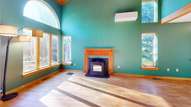 living room featuring a high ceiling and a wealth of natural light