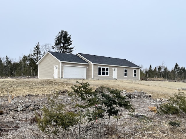 ranch-style house featuring a garage