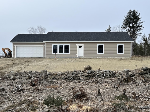 ranch-style house featuring a garage