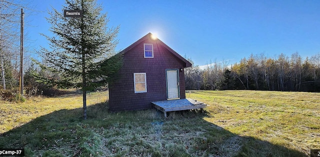 view of property exterior with a yard