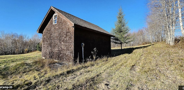 view of home's exterior with a lawn