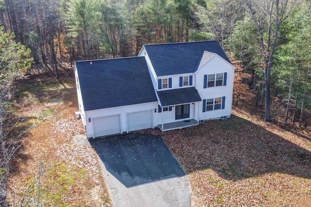 front facade featuring a garage and a porch