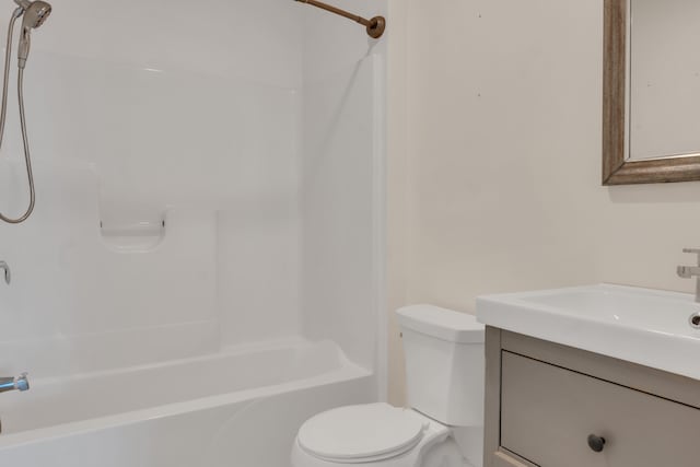 full bathroom featuring vanity, shower / tub combination, and toilet