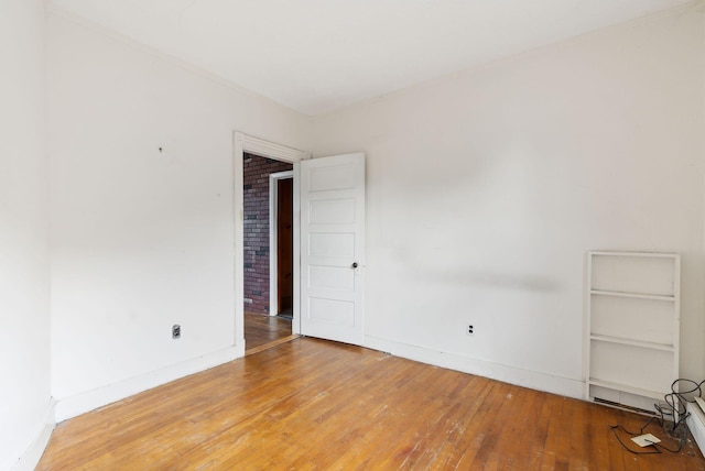 spare room with hardwood / wood-style flooring