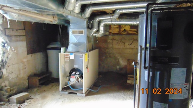 utility room featuring heating unit