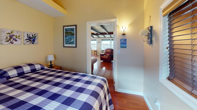 bedroom with wood-type flooring