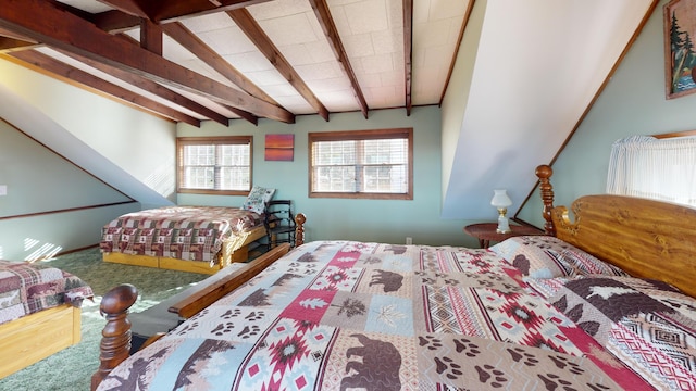 bedroom with vaulted ceiling with beams