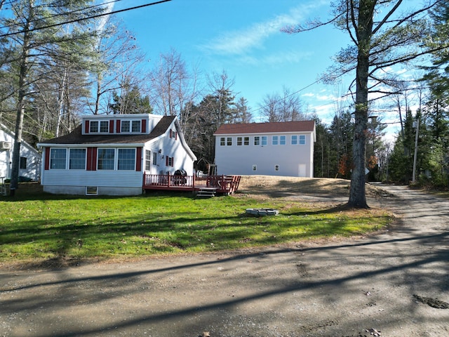 view of front of property with a front lawn and a wooden deck