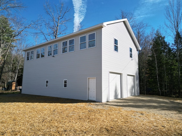 view of side of home with a garage