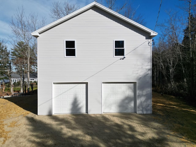 view of side of property with a garage