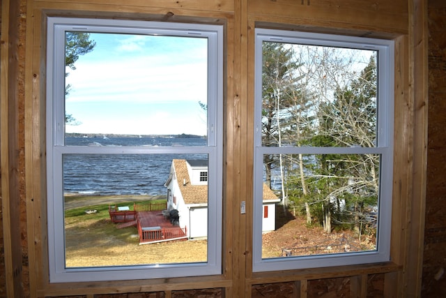 entryway featuring a wealth of natural light and a water view