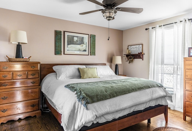 bedroom with hardwood / wood-style flooring and ceiling fan