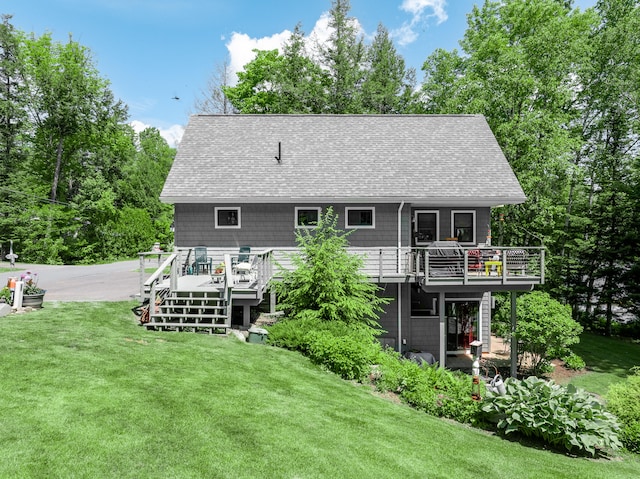 rear view of house featuring a wooden deck, a yard, and a patio area