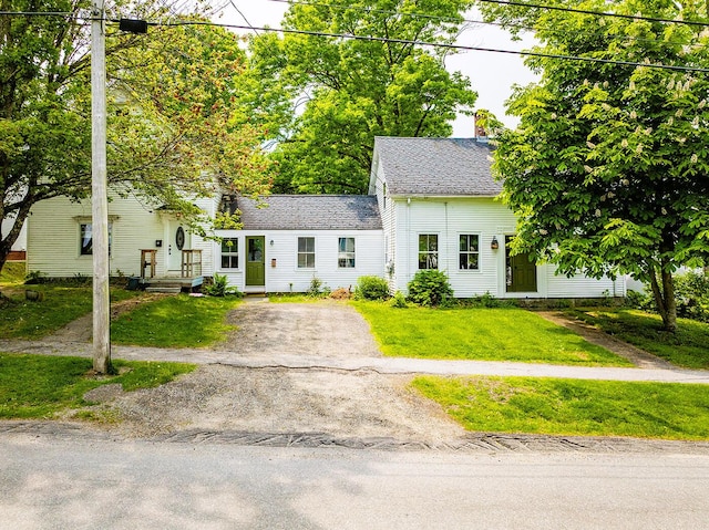 97 Chestnut St, Camden, ME 04843 - view of front of house featuring driveway, a front lawn, and roof with shingles