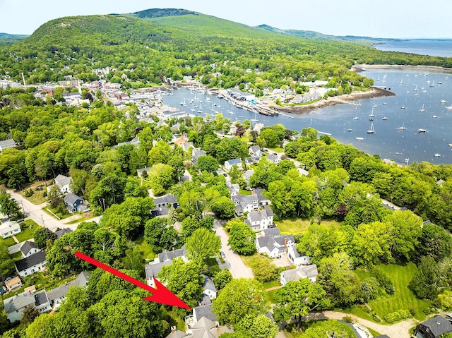97 Chestnut St, Camden, ME 04843 - aerial view of residential area featuring a water and mountain view and a heavily wooded area