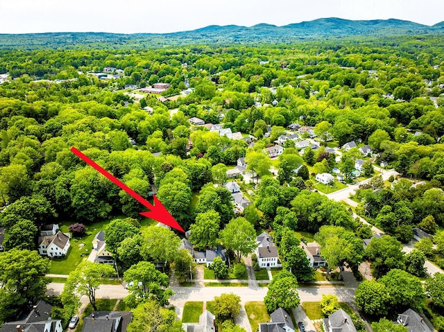 97 Chestnut St, Camden, ME 04843 - aerial view of residential area featuring a heavily wooded area and a mountainous background