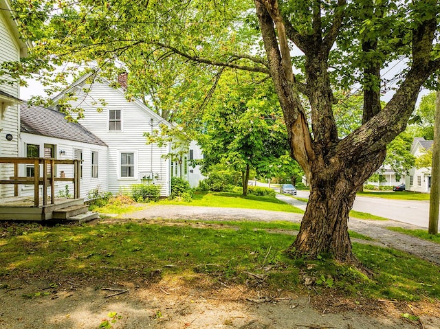 97 Chestnut St, Camden, ME 04843 - view of green lawn with a wooden deck