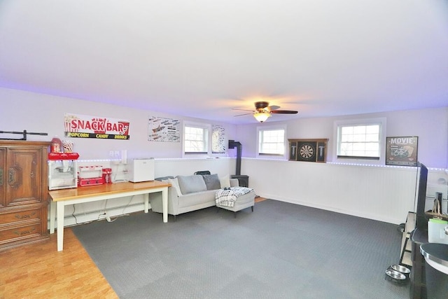 sitting room featuring hardwood / wood-style flooring and ceiling fan