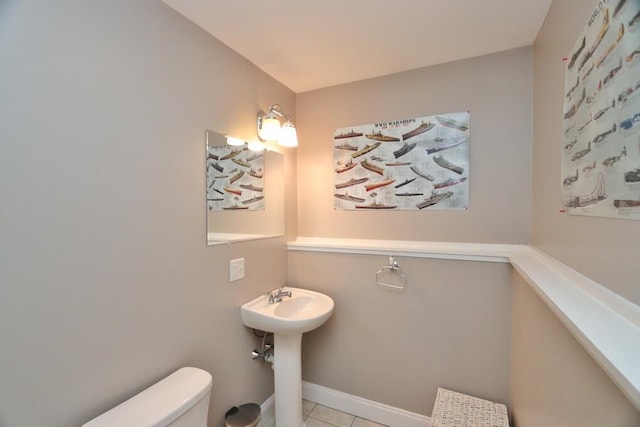 bathroom with tile patterned flooring and toilet