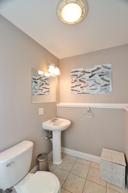 bathroom with tile patterned floors and toilet