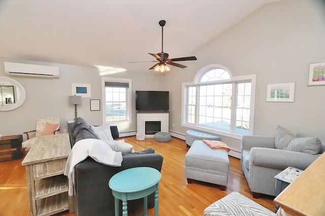 living room with an AC wall unit, a healthy amount of sunlight, vaulted ceiling, and hardwood / wood-style flooring