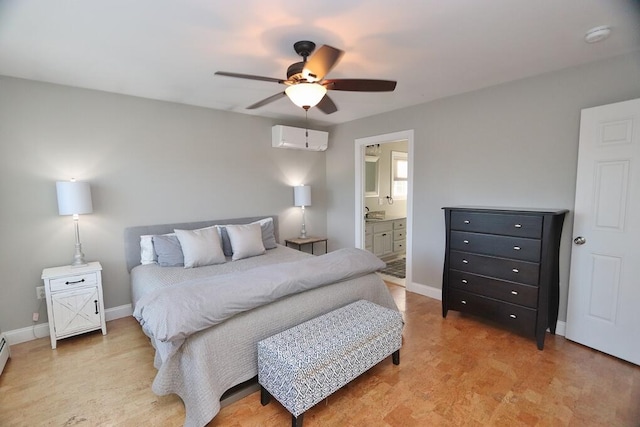 bedroom featuring a baseboard radiator, ensuite bath, ceiling fan, and an AC wall unit