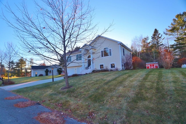 view of side of home featuring a yard