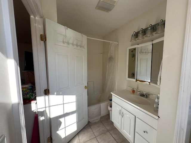 bathroom with tile patterned flooring, vanity, and shower / bathtub combination with curtain