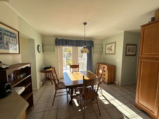dining room with ornamental molding, french doors, a baseboard radiator, and light tile patterned floors