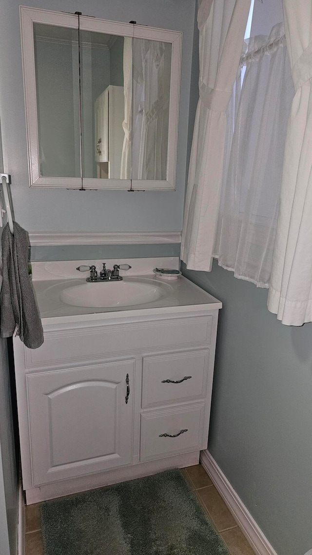 bathroom with vanity and tile patterned flooring