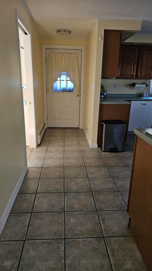 doorway with a baseboard radiator and light tile patterned floors