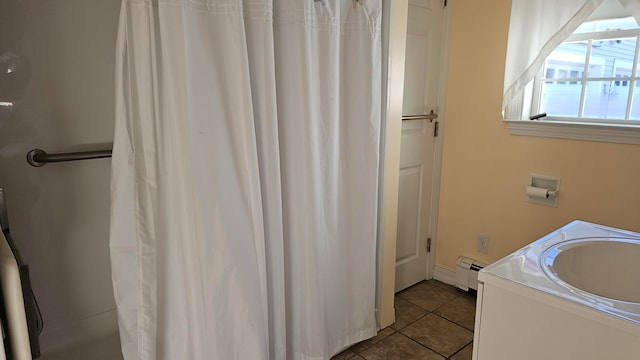 bathroom featuring baseboard heating, tile patterned flooring, vanity, and a shower with curtain