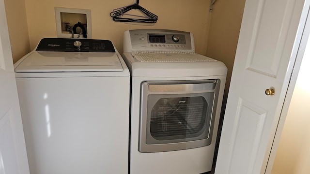 laundry room featuring separate washer and dryer