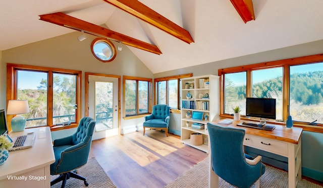 office space featuring beam ceiling, light wood-type flooring, and high vaulted ceiling