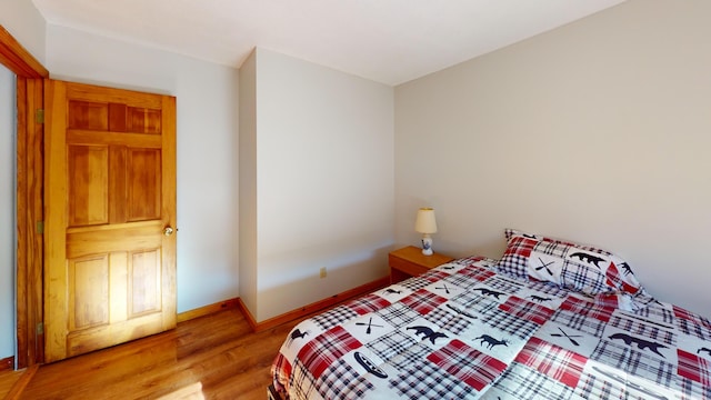 bedroom with light wood-type flooring