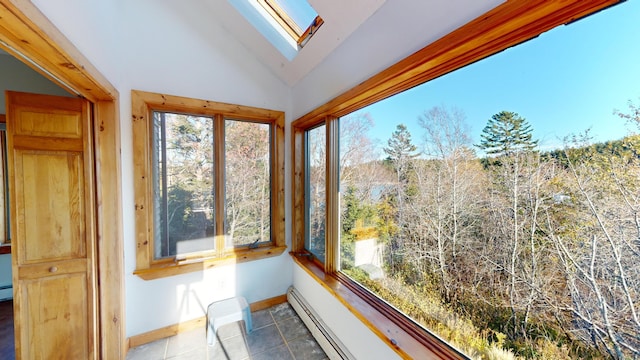 sunroom / solarium featuring lofted ceiling and a baseboard heating unit