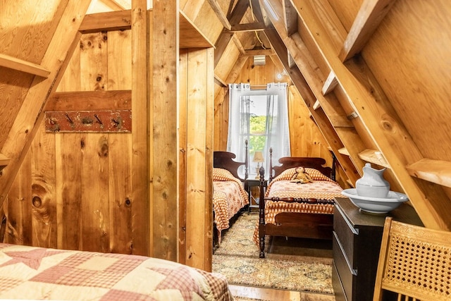 bedroom featuring wooden walls and vaulted ceiling