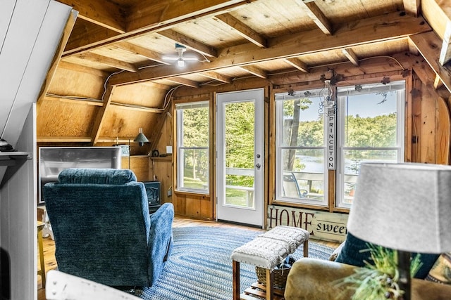 sunroom featuring ceiling fan, plenty of natural light, wooden ceiling, and lofted ceiling